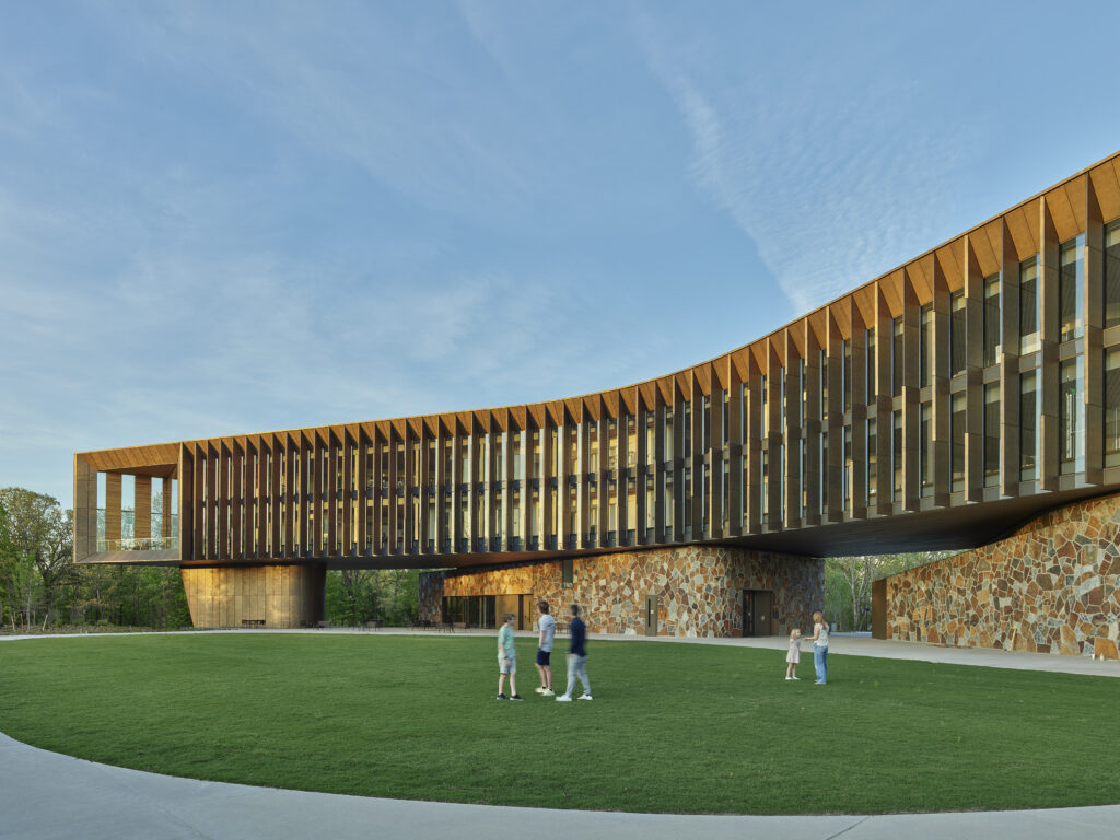 Rear exterior image showing the courtyard and weathered brass fins.