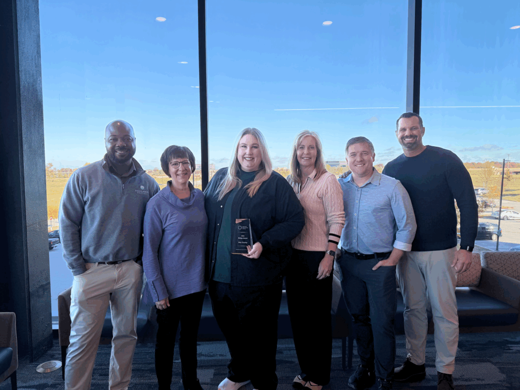 Highlands Oncology leadership team stands for a photo with Amy.